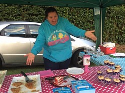 Karen at the Yateley 10k series, cakes sold out!