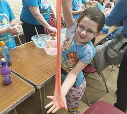 Tianna having great fun with slime at The Hub for Deaf Children